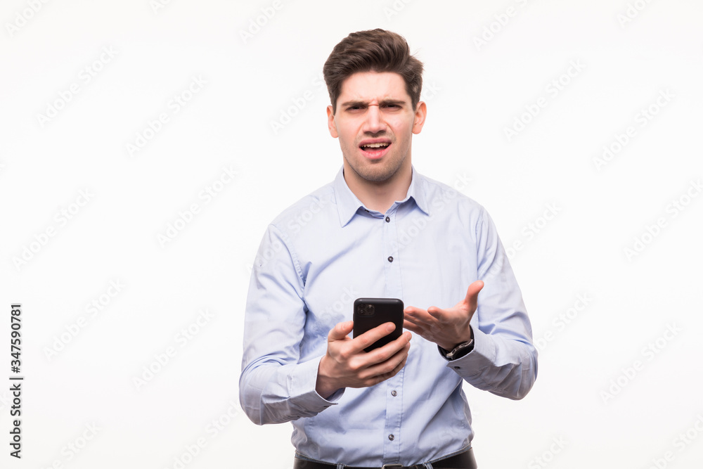 Portrait of amazed young man using smartphone isolated on white background Portrait of amazed young man using smartphone isolated on white background