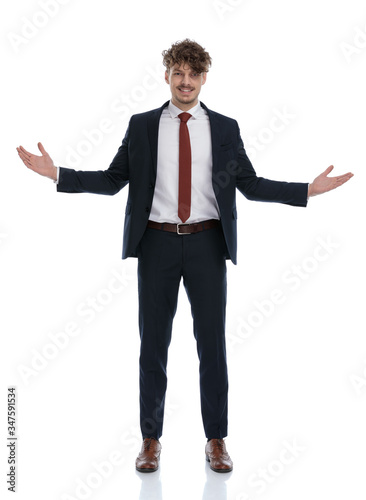 Positive businessman smiling and welcoming with his hands open