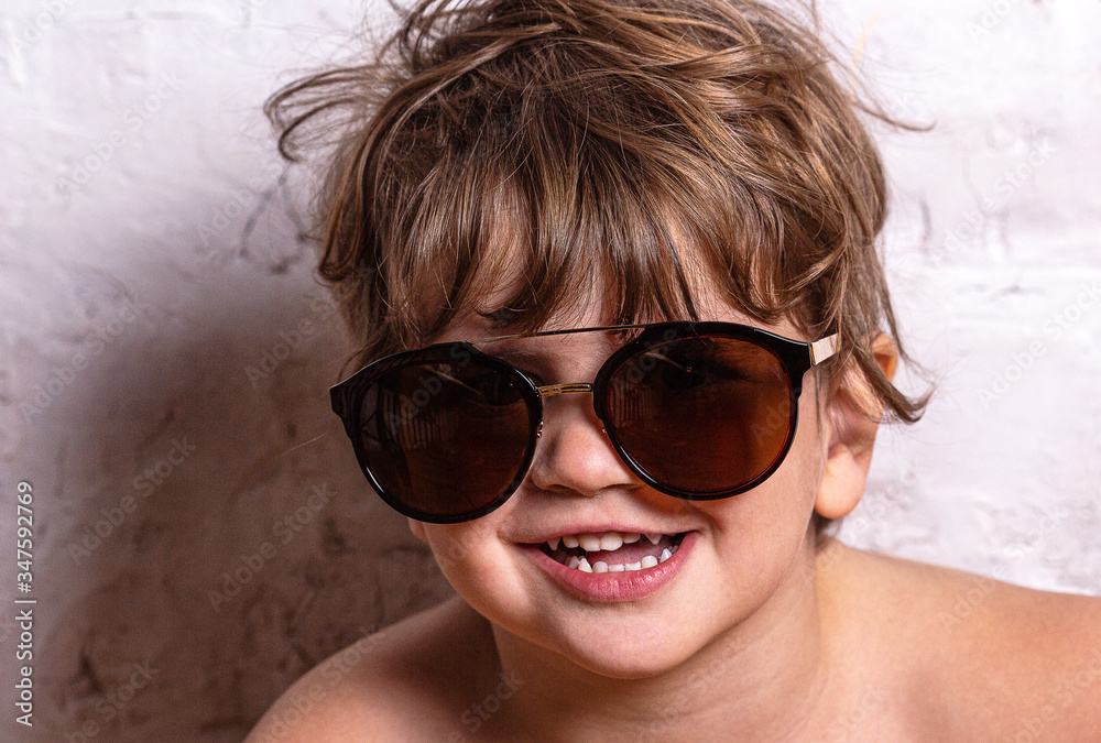 Playful girl in sunglasses making faces to the camera Playful girl in sunglasses making faces to the camera