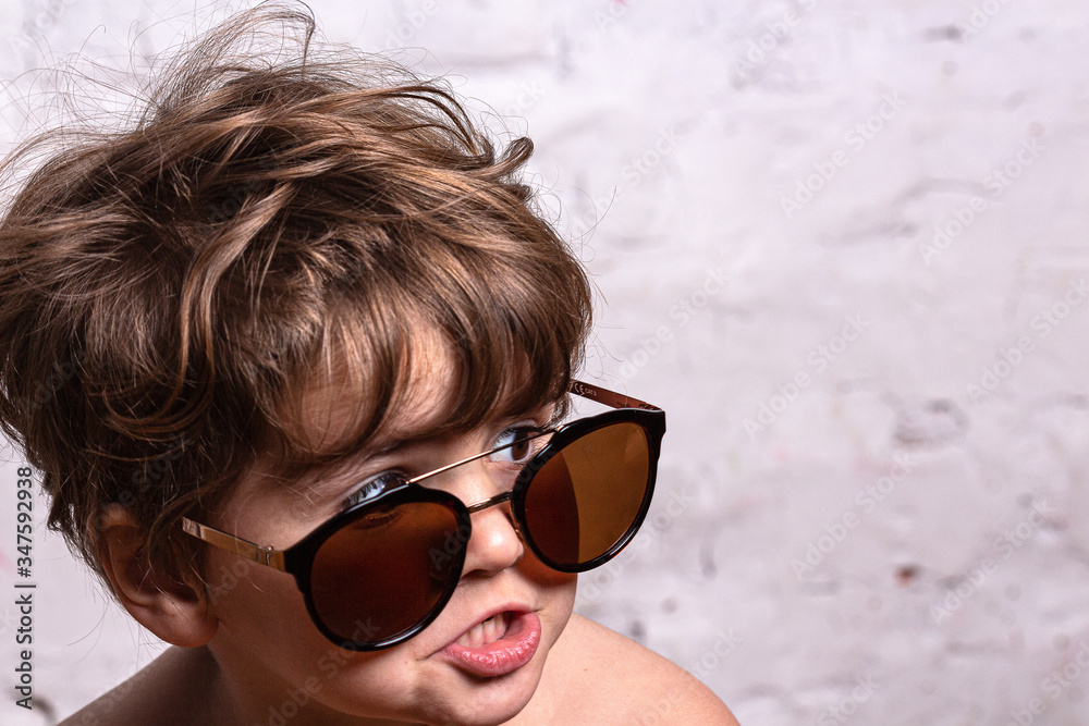 Playful girl in sunglasses making faces to the camera Playful girl in sunglasses making faces to the camera