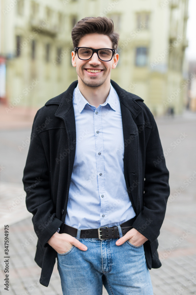Fashionable man posing on the city street. Lifestyle Fashionable man posing on the city street. Lifestyle