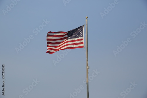 american flag in the wind with copy space for text