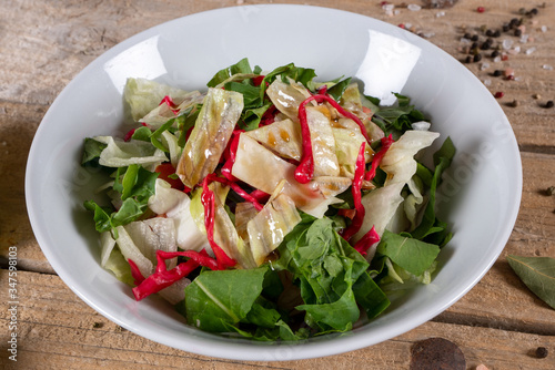 fresh vegetable salad. Shepherd's salad, top view on a black background photo