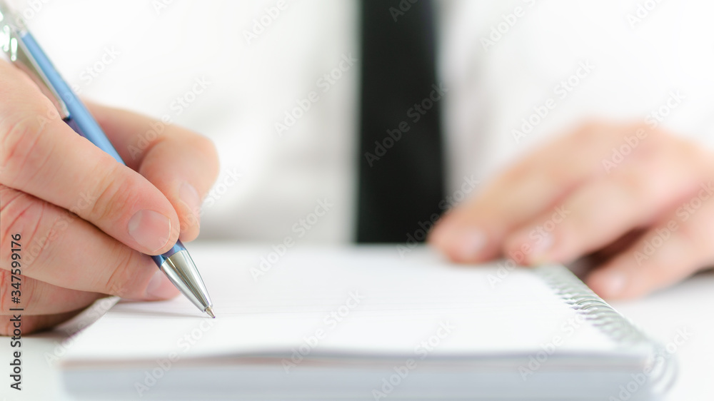 Businessman ready to take notes on an empty note pad Businessman ready to take notes on an empty note pad