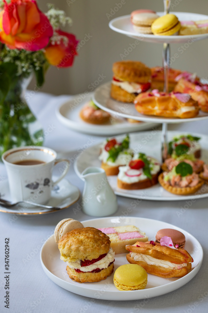 Traditional afternoon tea with canapes and cakes Traditional afternoon tea with canapes and cakes