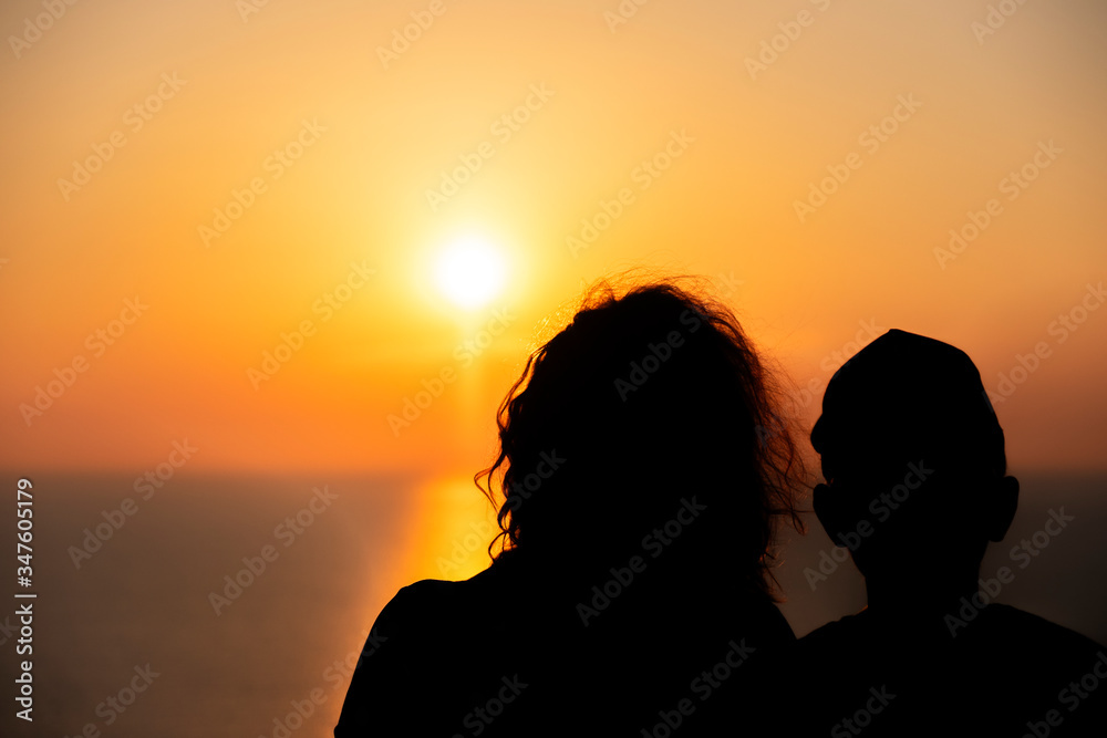 Silhuette of Mother and Son at the sunset