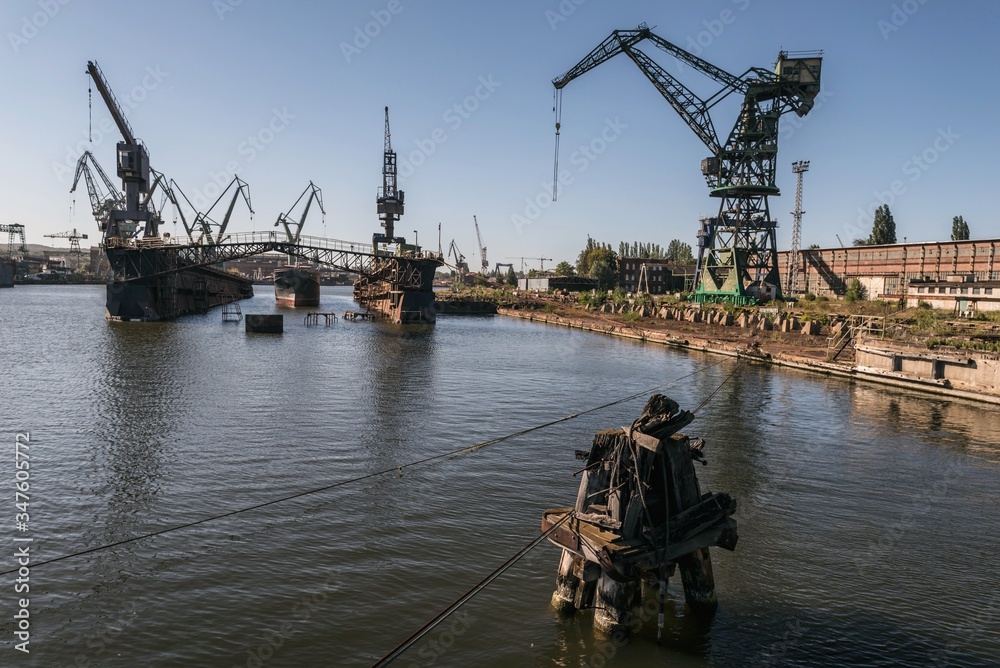 One of the largest Polish shipyards, located in Gdańsk on the left bank of the Martwa Wisła and Ostrów in Poland - obrazy, fototapety, plakaty 