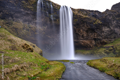 Seljalandsfoss falls in Iceland on a spring day with heavy water fall