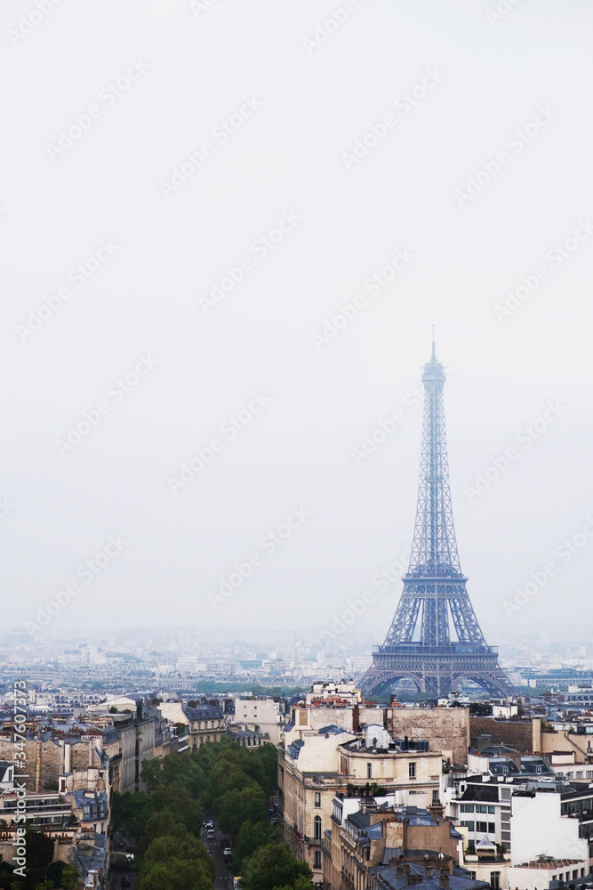 Beautiful view of Paris city with Eiffel Tower and typical parisian architecture.