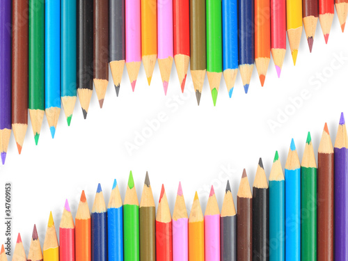 Close up of color pencils with different color over white background