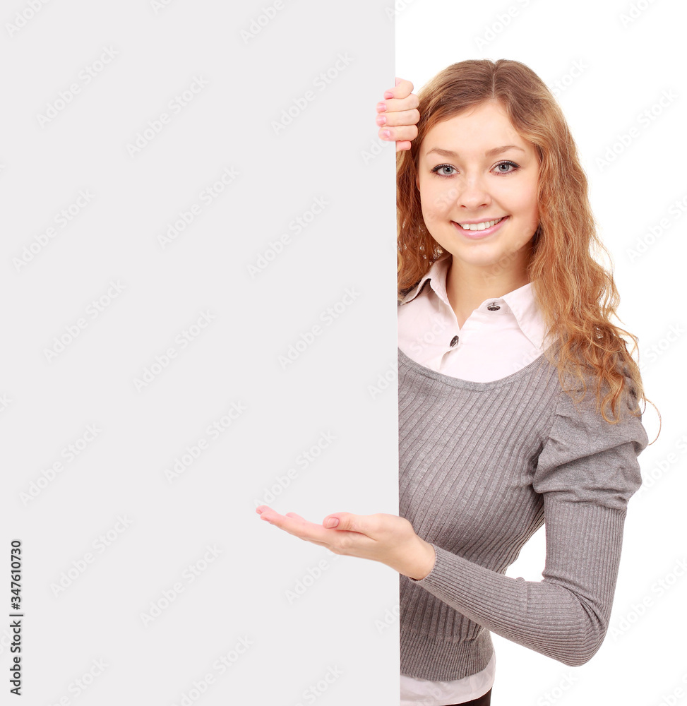 woman holding sign - Portrait of a beautiful woman holding a blank billboard.