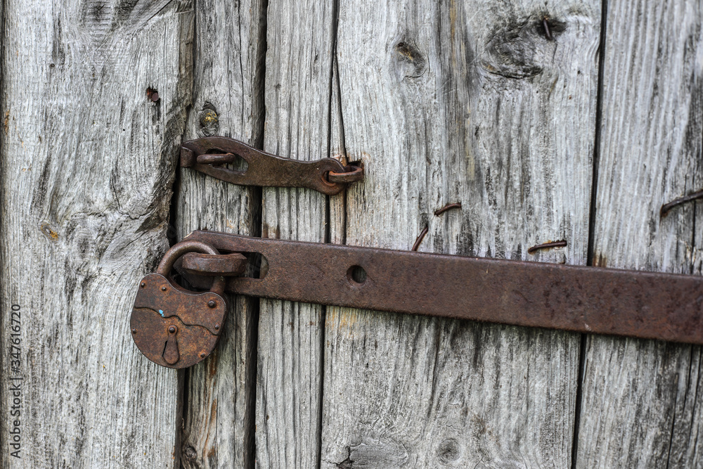 old vintage lock on a wooden door