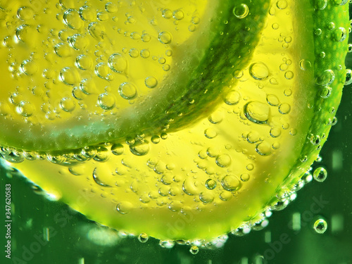 Fototapeta Naklejka Na Ścianę i Meble -  lime in lemonade. beautiful macro photography of citrus fruits.