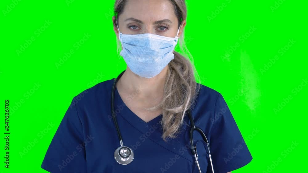 4K Portrait of female nurse doctor on green screen isolated with chroma key. Woman wearing surgical face mask standing looking at camera
4K Portrait of female nurse doctor on green screen isolated with chroma key. Woman wearing surgical face mask standing looking at camera