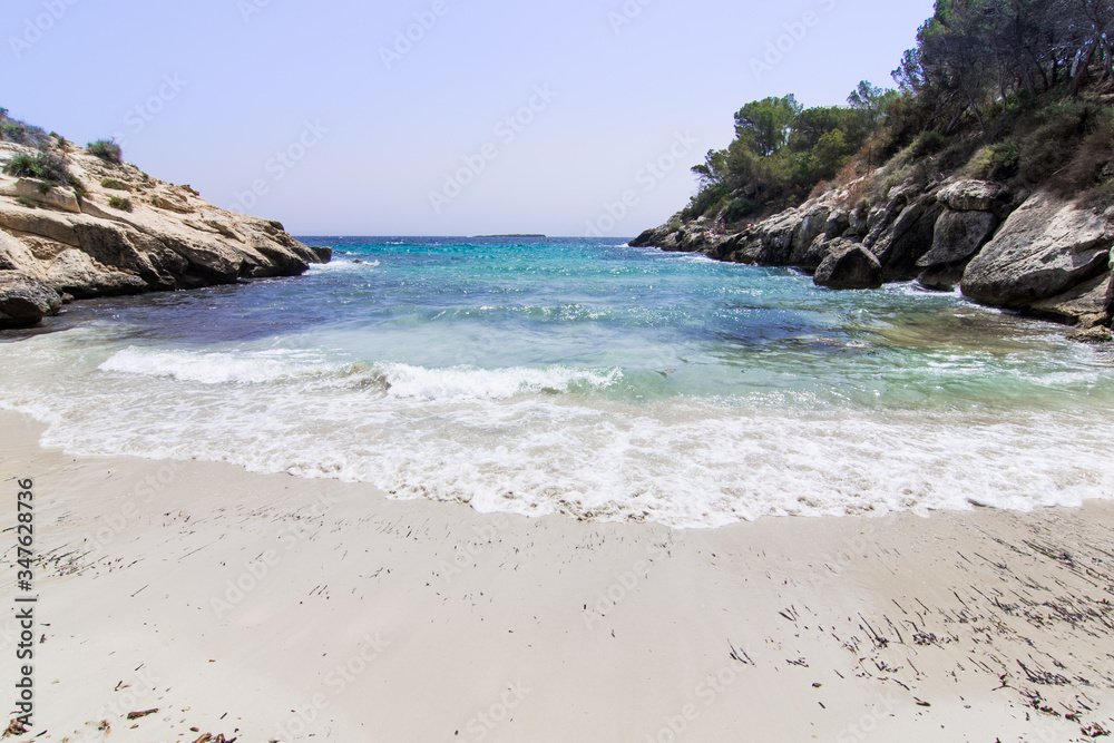 Lonely beach with blue sky, Caló de la Bella Dona, Mallorca