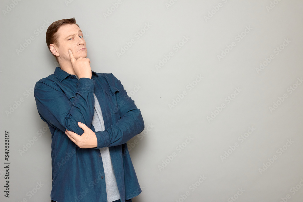 Portrait of thoughtful serious mature man thinking hard Portrait of thoughtful serious mature man thinking hard
