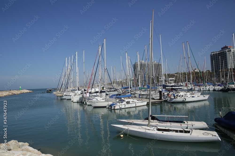 yacht and catamaran in the marina blue sky and blue see background. Banner, pattern, background.