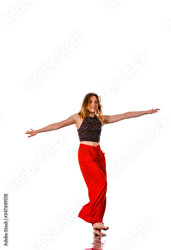 Portrait of young stylish woman street dancer posing in studio