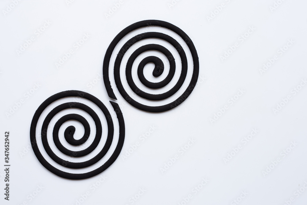 Black spiral mosquito repellent coils on white background. Black spiral mosquito repellent coils on white background.