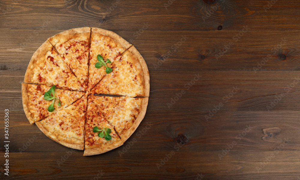 cheese pizza on dark wooden background top view. cheese pizza on dark wooden background top view.