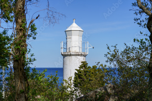 Wallpaper Mural Old white lighthouse at Stenhuvud national park in Simrishamn, Sweden. Selective focus. Torontodigital.ca