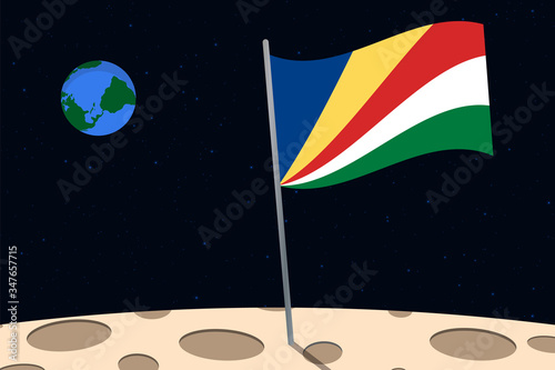 View of planet Earth from the surface of the Moon with the Seychelles flag and holes on the ground