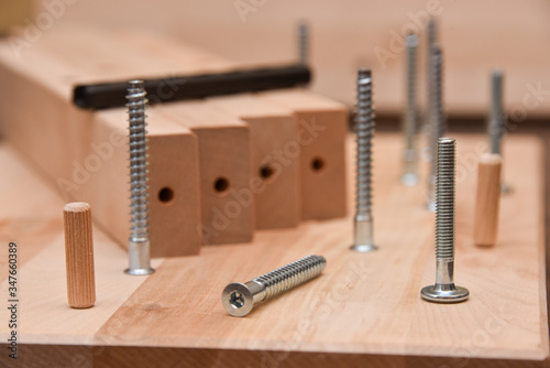 tools, screws and wooden parts for self-assembly of furniture