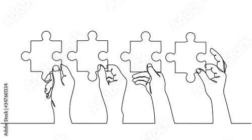 Continuous line drawing of hands solving Two Puzzle Pieces. Concept of business teamwork and integration with puzzle. Teamwork and partnership concept of two businessman isolated on white background. photo