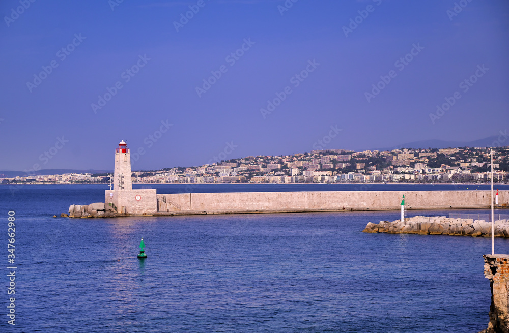 The lighthouse at the Port of Nice on the Mediterranean Sea at Nice, France along the French Riviera.