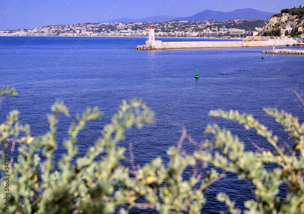 The lighthouse at the Port of Nice on the Mediterranean Sea at Nice, France along the French Riviera.
