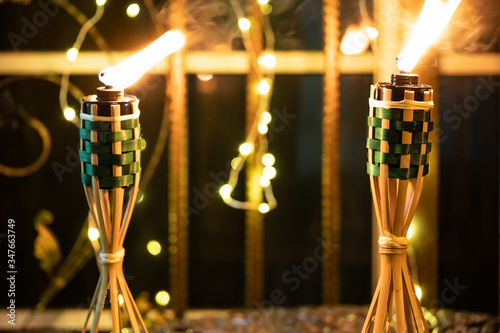 Bamboo oil lamp or pelita for eid or hari raya decoration photo