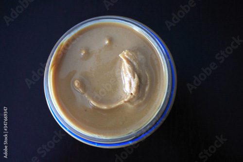 Flat lay view of peanut butter jar