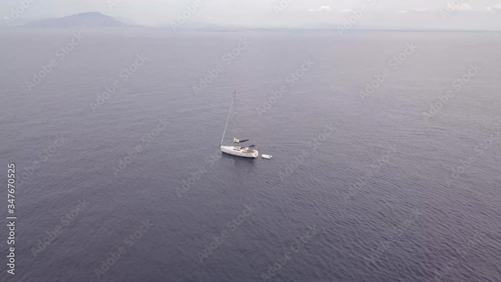 Sailing boat cruising on calm ocean in teh Mediterranean Sailing boat cruising on calm ocean in teh Mediterranean