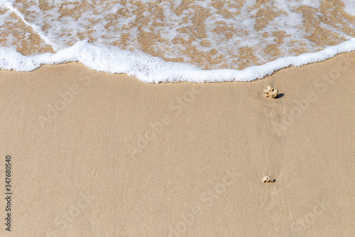 White wave on fine sand beach, summer concept background, tropical weather, outdoor day light, holiday background