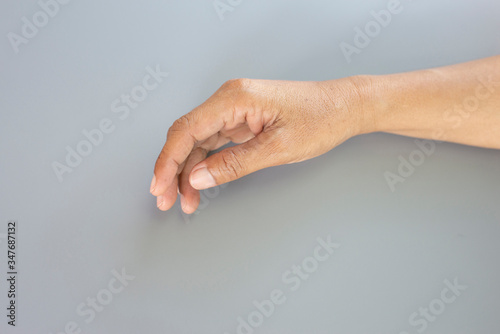 A weak hand on a gray background