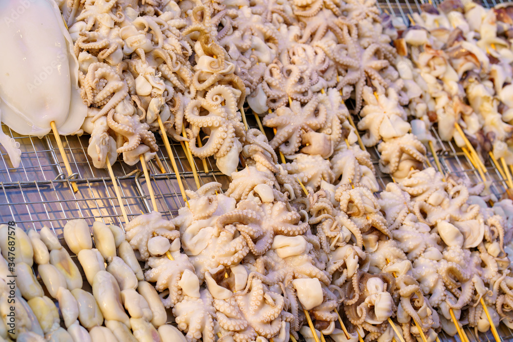 Grilled Squid in street food market thailand