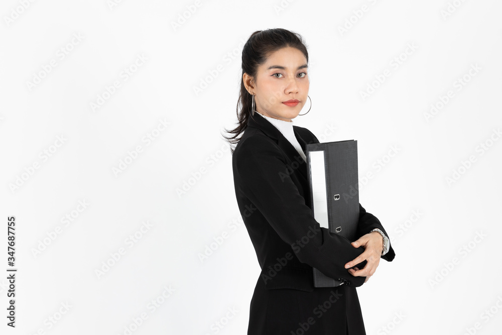 Portrait of confident young Asian business woman in suit hold document folders or ring binder on white isolated background Portrait of confident young Asian business woman in suit hold document folders or ring binder on white isolated background