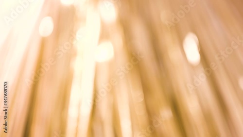 4K Prores of Gold bokeh ribbon. Gold Shiny Bokeh. Energetic, rapid, shimmering golden bokeh.
