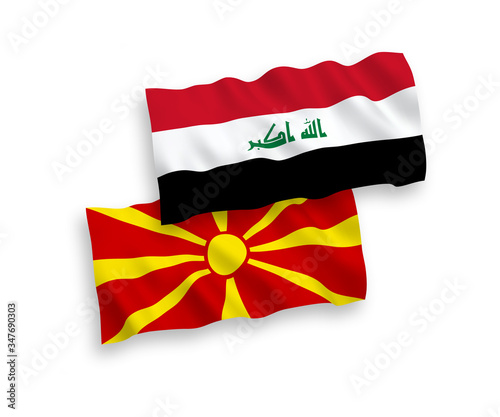 National vector fabric wave flags of Iraq and North Macedonia isolated on white background. 1 to 2 proportion.