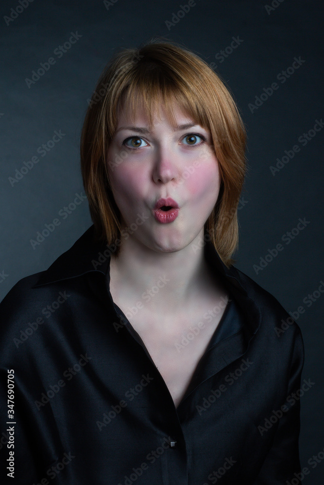 Portrait of redheaded girl going crazy, making a duck face Portrait of redheaded girl going crazy, making a duck face