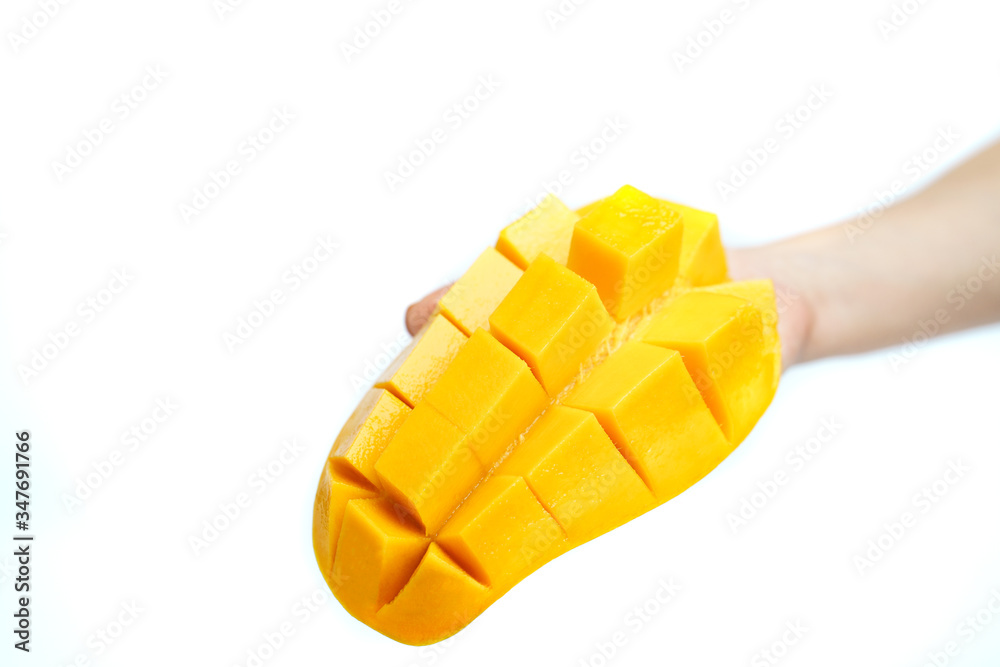Hand with Yellow mango and mango slice on cubes isolated white isolated background , Hand Hand with Yellow mango and mango slice on cubes isolated white isolated background , Hand