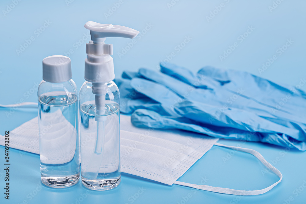 Hand sanitizers, protection against viruses and bacteria. Medical mask, gloves, close-up, copy space. Hand sanitizers, protection against viruses and bacteria. Medical mask, gloves, close-up, copy space.