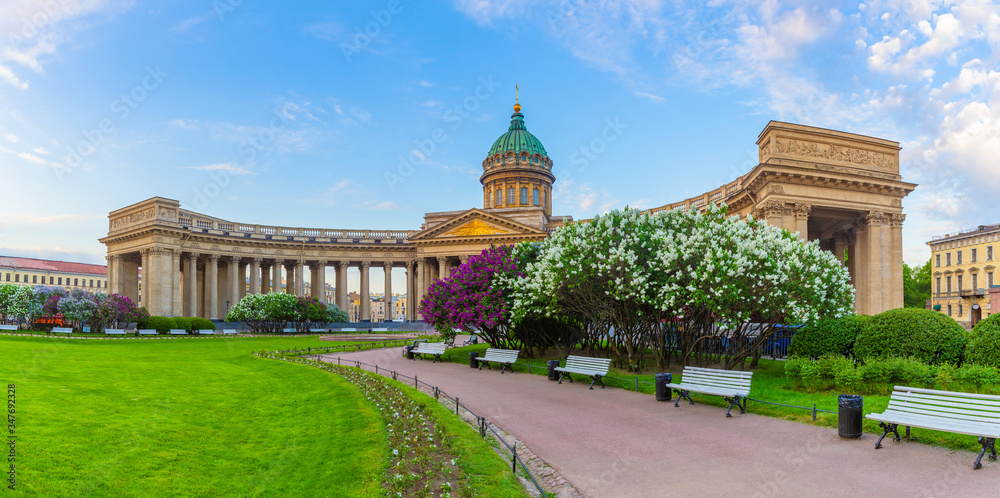 Saint Petersburg. Russia. Panorama of St. Petersburg during the lilac bloom. Kazan Cathedral against the blue sky. View from Nevsky Prospekt to Kazan Cathedral. Lilac blooms on Kazan square.
