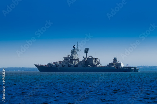 Warship. Missile cruiser. Military ship close-up. Fleet. Navy. Protection of the state's Maritime borders. Ship against the blue sky. Combat duty on the water. © Grispb