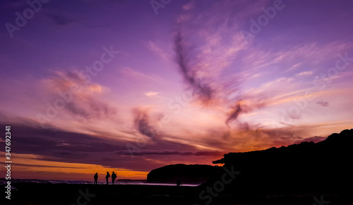 Purple sky and people silhouette
