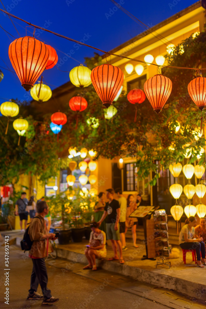 Wonderful evening view of street decorated with lanterns, Hoi An
