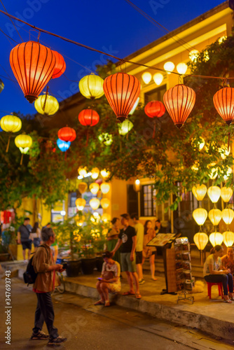 Wonderful evening view of street decorated with lanterns  Hoi An
