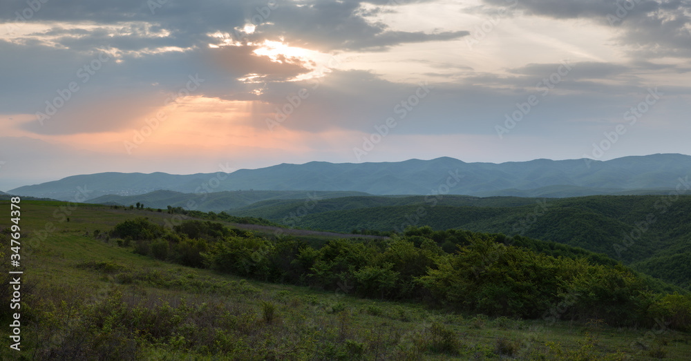  Panoramic view of sunrise in a beautiful green field. Kakheti, Georgia