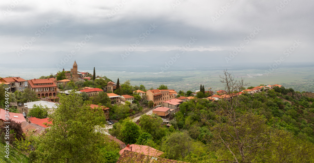 Panoramic view of Sighnaghi in winery region of Georgia, Kakheti, with Caucasus mountains in the background