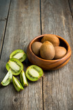 Fresh and ripe sliced kiwi on the rustic background. Selective focus. Shallow depth of field.